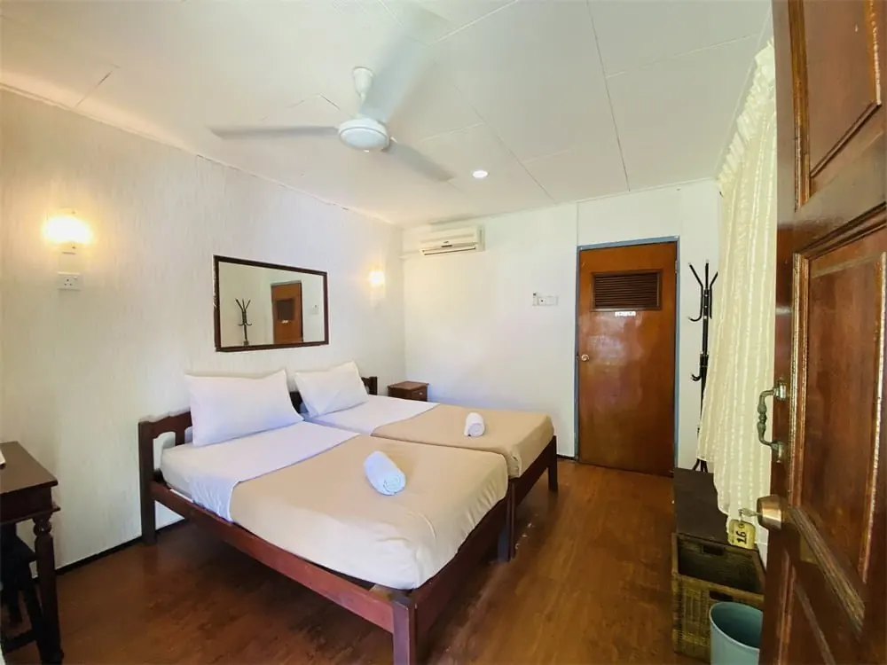 Impian Inn twin room interior with two beds Tioman Island